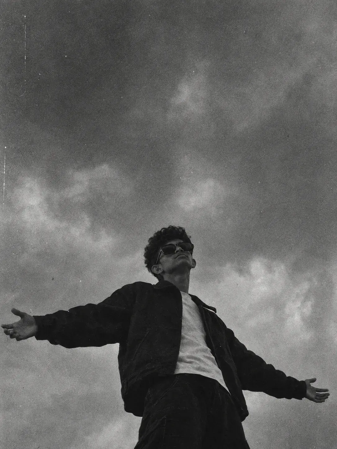 A Black And White Grainy Person Standing