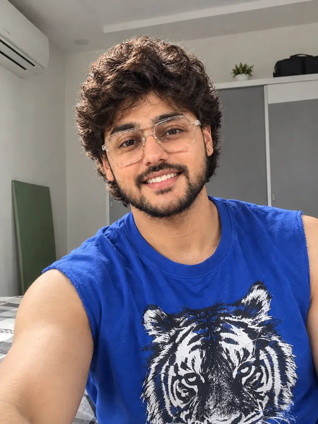A Bright Portrait Of A Young Boy Wears A Royal Blue Sleeveless Cut-Off T-Shirt.
