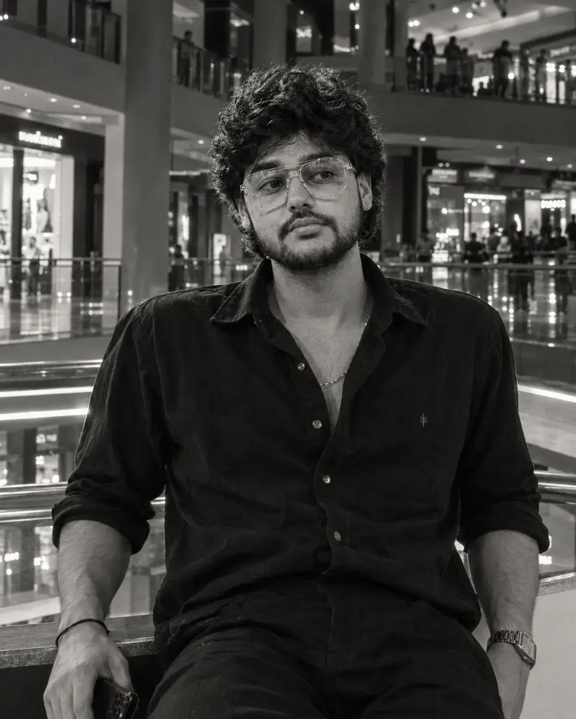 A Moody Black-And-White Mall Portrait With Strong Contrast.