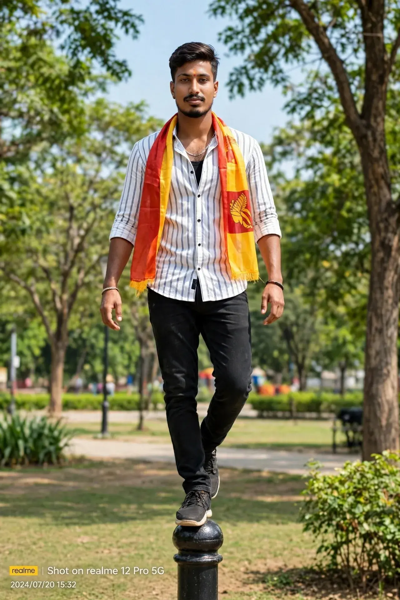 A Young Indian Man Balancing On A