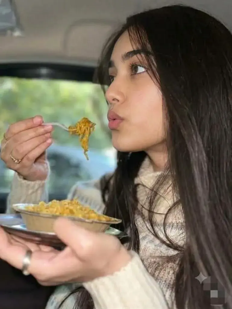 A Young Woman Enjoys A Quick Meal Of Noodles In Her Car