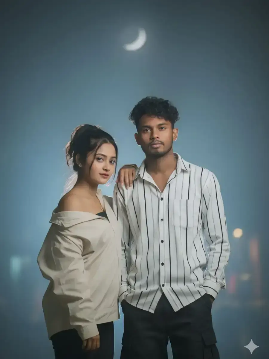 Atmospheric Night Sky Portrait Of Young South Asian Couple Under Crescent Moon With Man In Striped Shirt And Woman In Of
