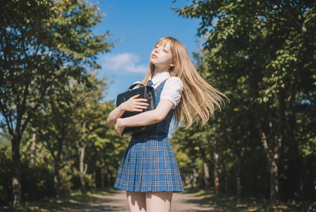 Blonde Girl In School Uniform On Tree-Lined Street