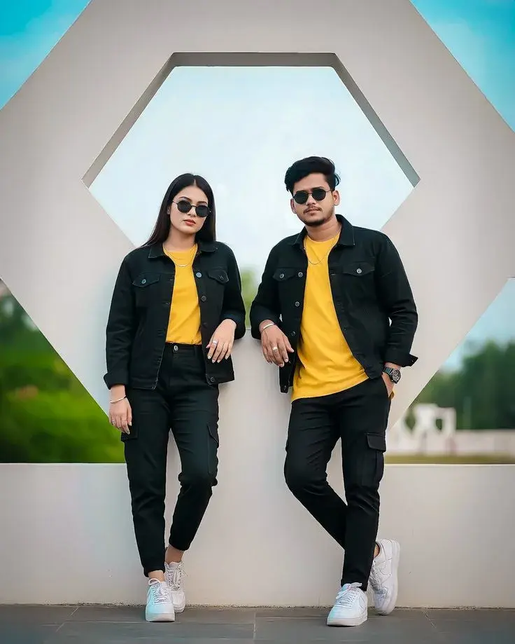 Candid Architectural Hexagon Monument Portrait Of Stylish Young South Asian Couple In Matching Yellow T-Shirts And Black
