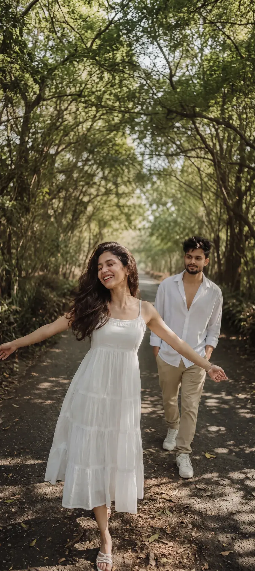 Candid Full-Length Outdoor Portrait Of Young Indian Couple On Forest Pathway