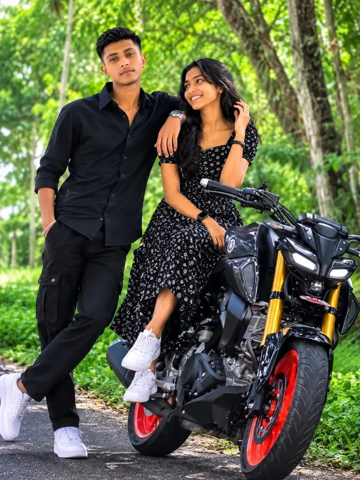 Candid Full-Length Outdoor Portrait Of Young Indian Couple With Sports Motorcycle