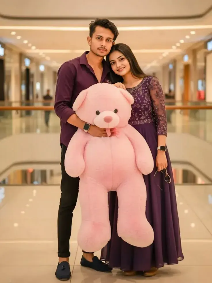 Candid Full-Length Shopping Mall Portrait Of Indian Couple With Giant Pink Teddy Bear