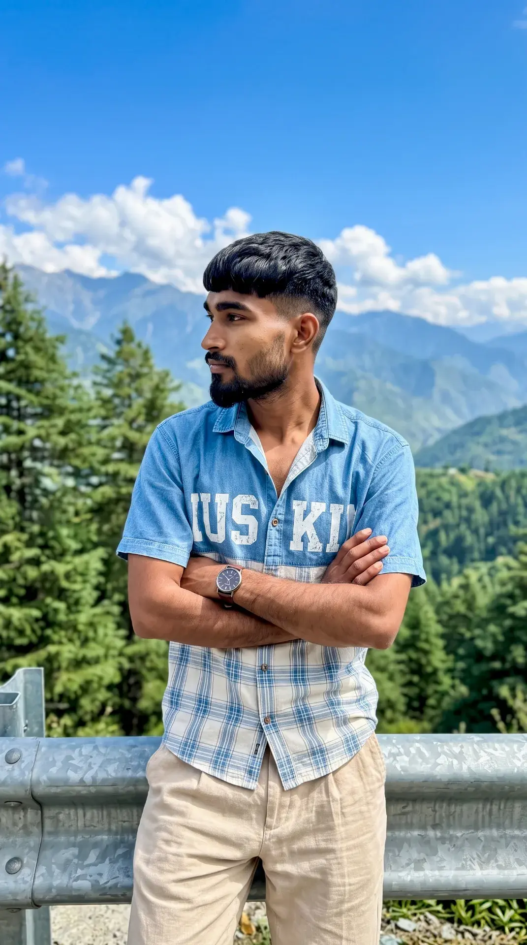 Candid Mountain Highway Portrait Of Young South Asian Man With Mushroom Crop Hair Leaning On Metal Crash Guardrail