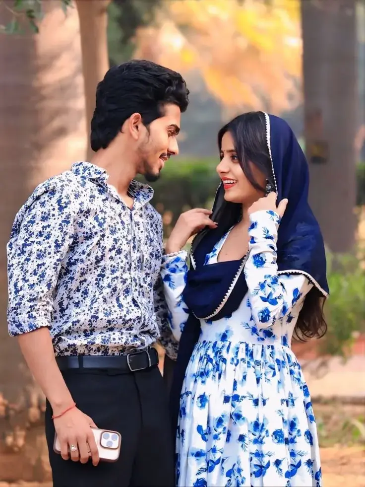 Candid Outdoor Portrait Of Indian Couple In Blue Floral Coordinated Outfits
