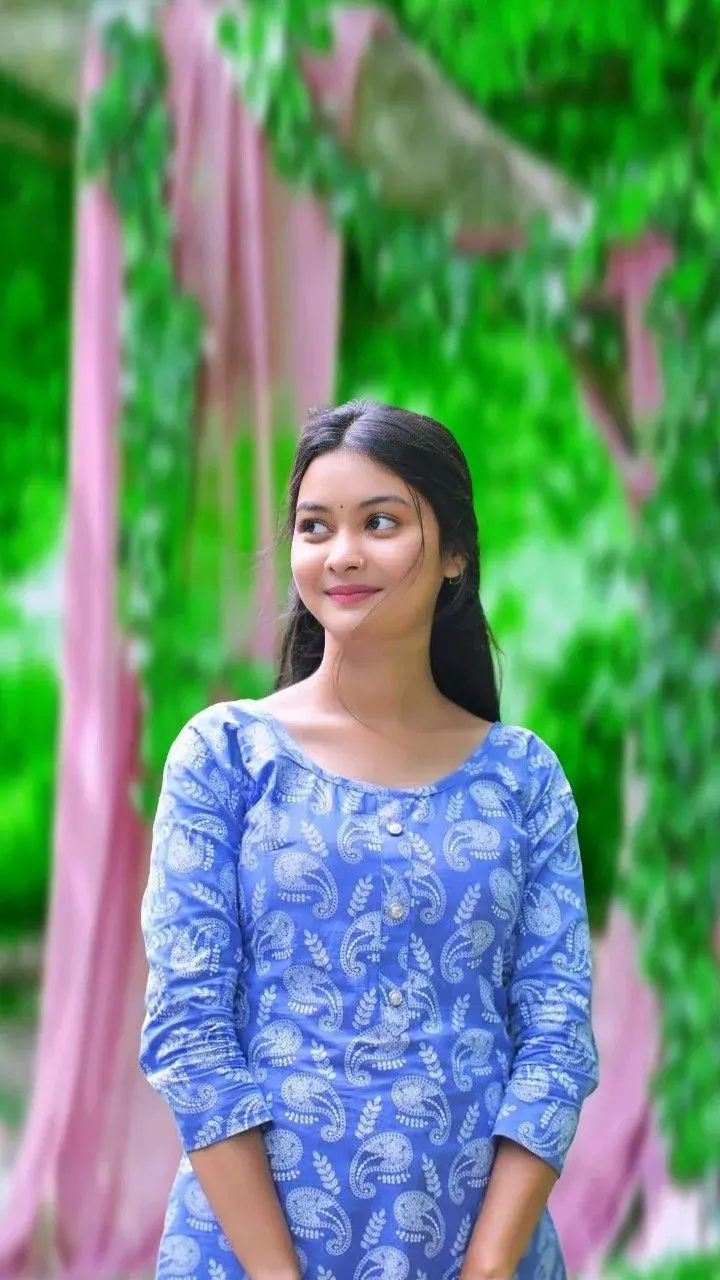 Candid Outdoor Portrait Of Indian Woman In Blue Paisley Kurti