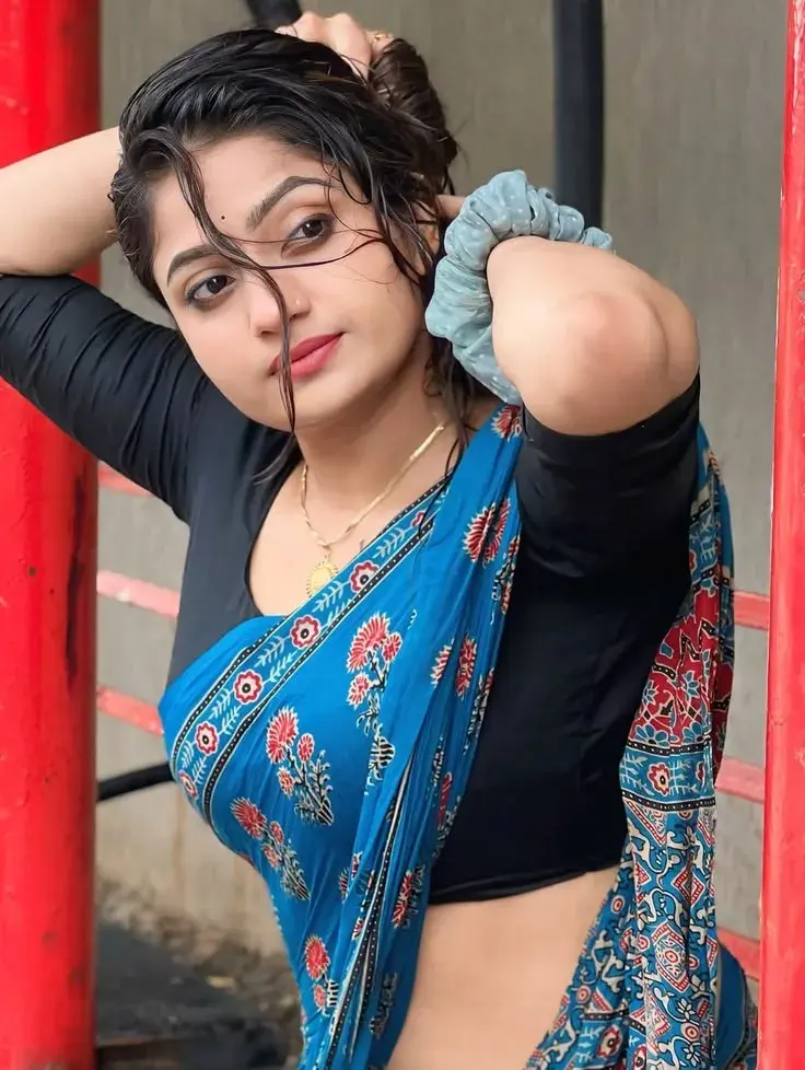 Candid Outdoor Portrait Of Indian Woman In Blue Saree With Wet Hair Pose