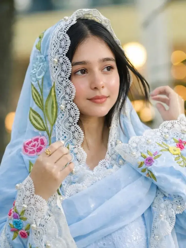 Candid Outdoor Portrait Of Serene Young South Asian Woman In Sky Blue Embroidered Dupatta With Pearl Lace