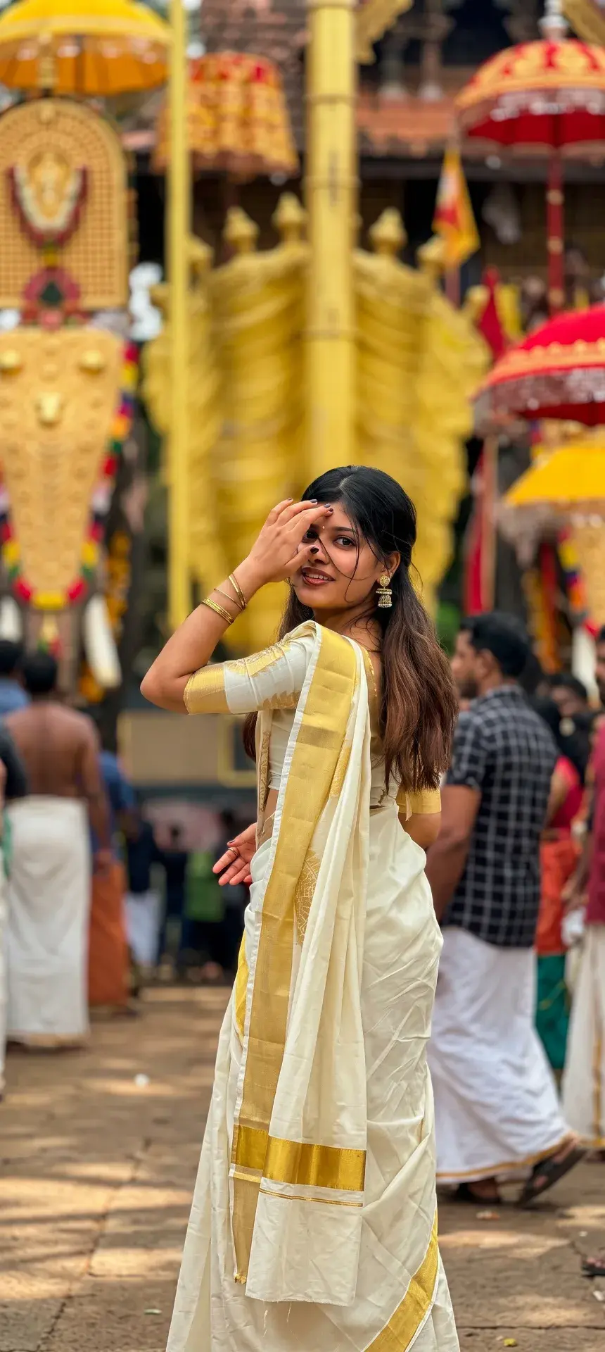 Candid Outdoor Portrait Of Young Indian Woman In Kasavu Saree At Temple Festival