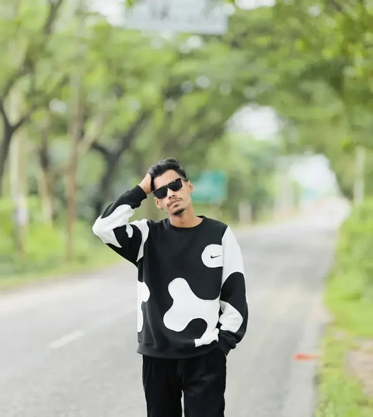 Candid Outdoor Street Portrait Of Young Indian Man On Tree-Lined Road