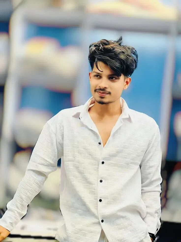 Candid Outdoor Waist-Up Portrait Of Stylish Young Indian Man In Textured White Shirt