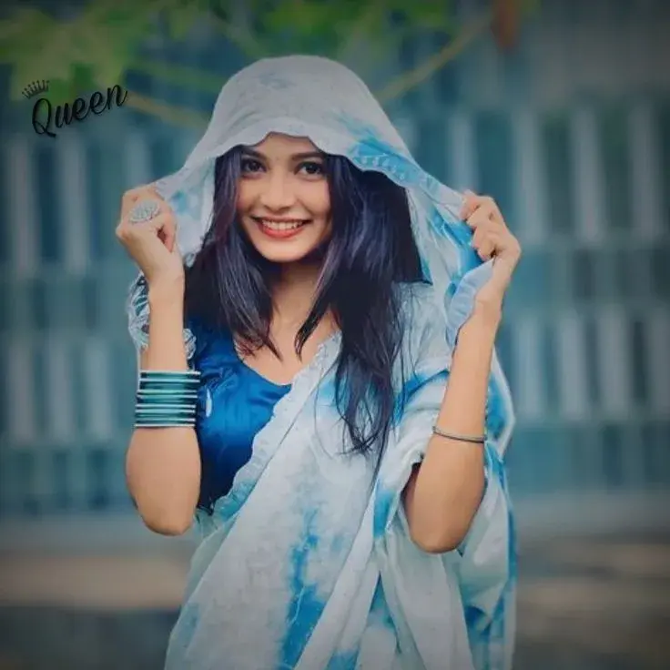 Candid Woman In Blue Tie-Dye Saree With Pallu Over Head