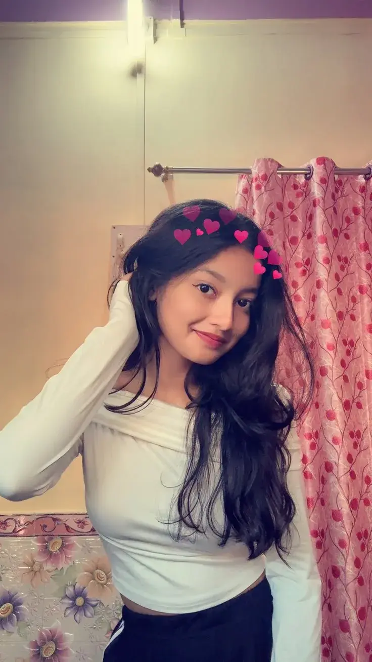 Candid Woman In White Off-Shoulder Crop Top With Heart Crown Filter