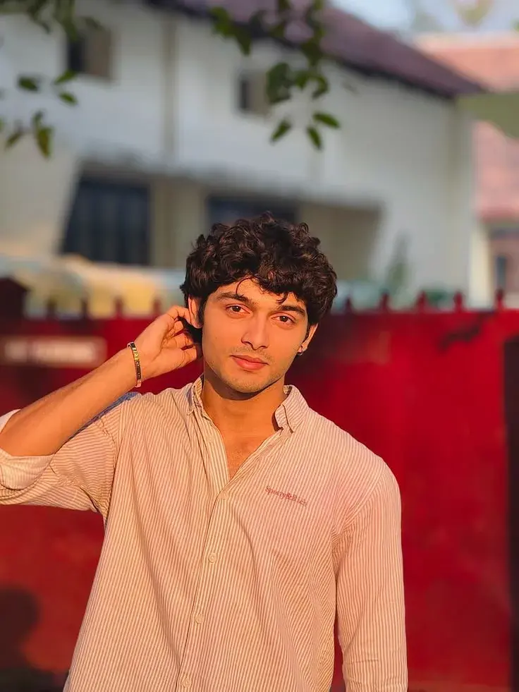 Candid Young Man In Pink Striped Shirt In Golden Sunset Light