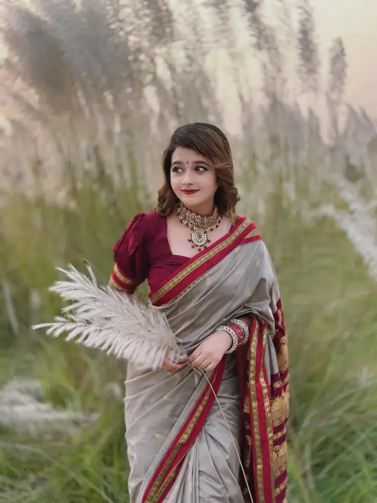 Close-Up Photo Of A Woman In A Traditional Indian Sari,