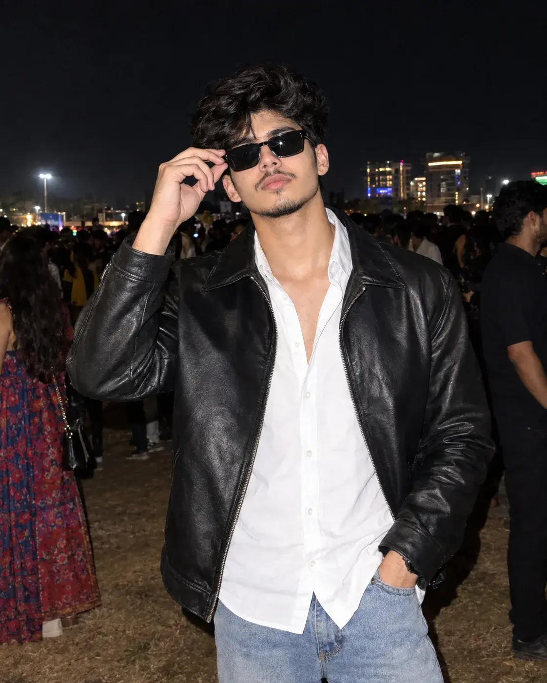 Cool Young Man In Leather Jacket And Sunglasses At Nighttime Outdoor Event