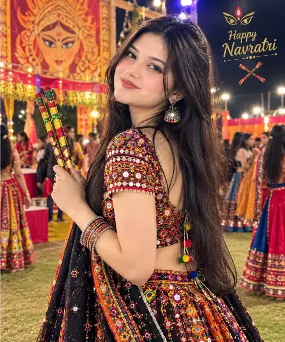 Festive Navratri Portrait Of Young Woman With Dandiya Sticks Before Maa Durga Pandal
