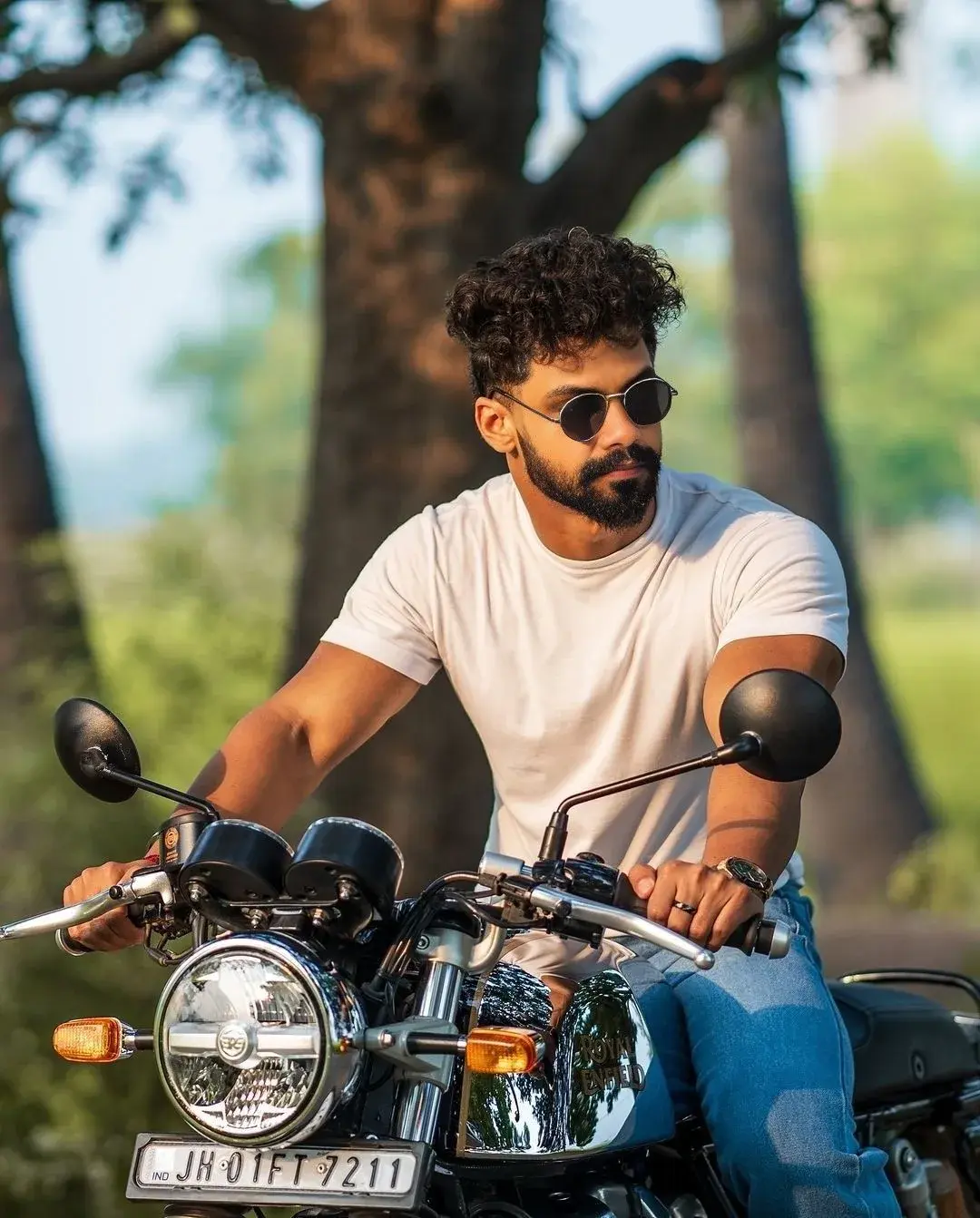 Golden Hour Bike Rider Portrait – White Tee & Sunglasses