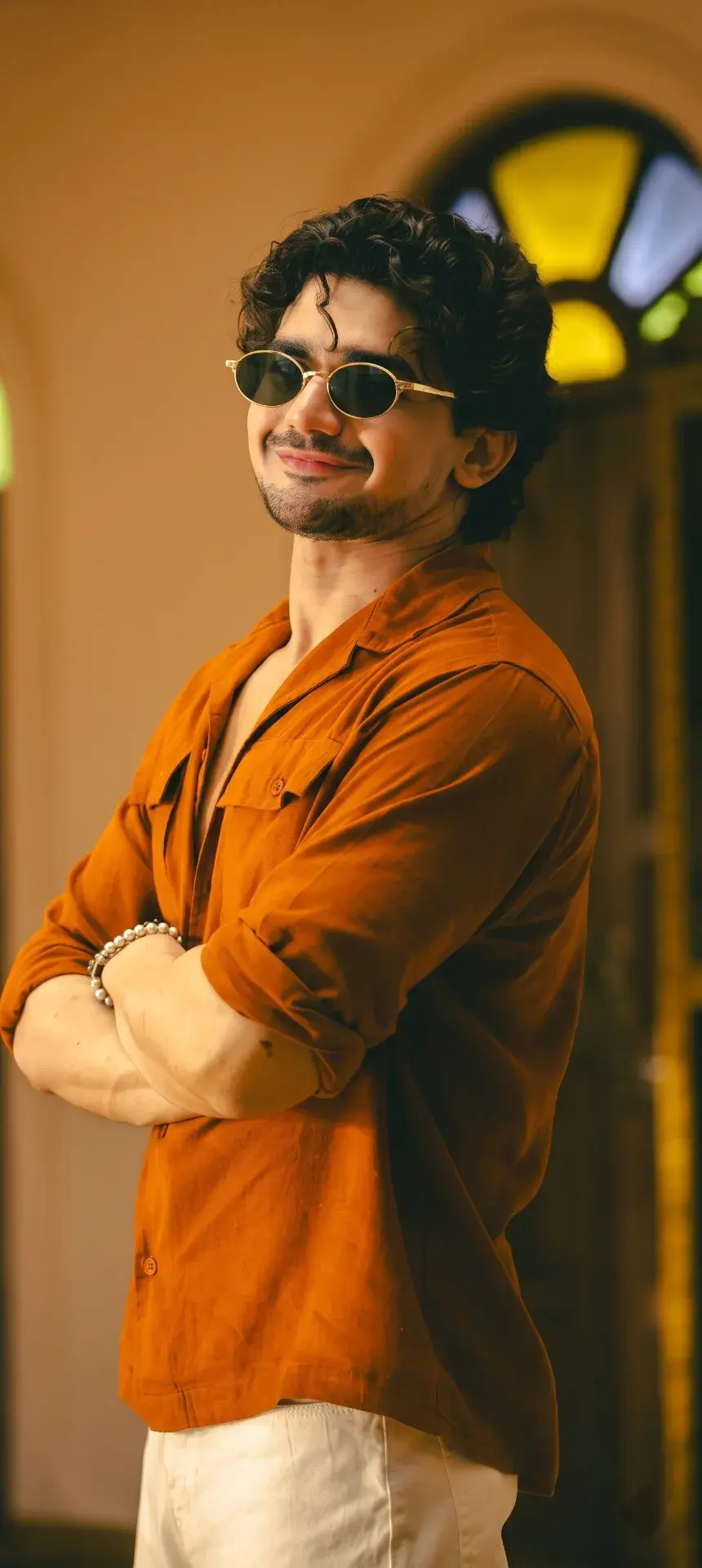 Golden Hour Heritage Elegance: Confident Young Man In Terracotta Shirt