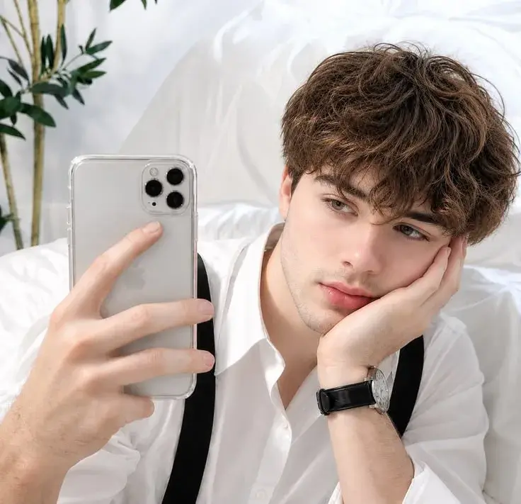 Handsome Young Man Taking A Selfie In A White Shirt