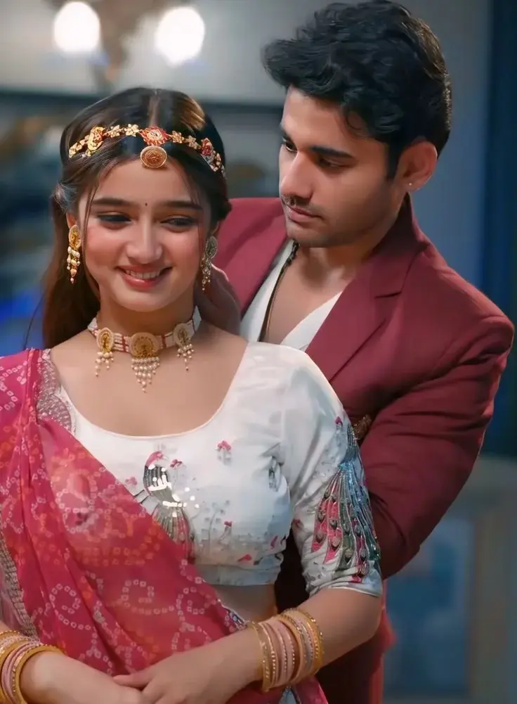 Intimate Candid Portrait Of Young South Asian Couple In Traditional Festive Attire