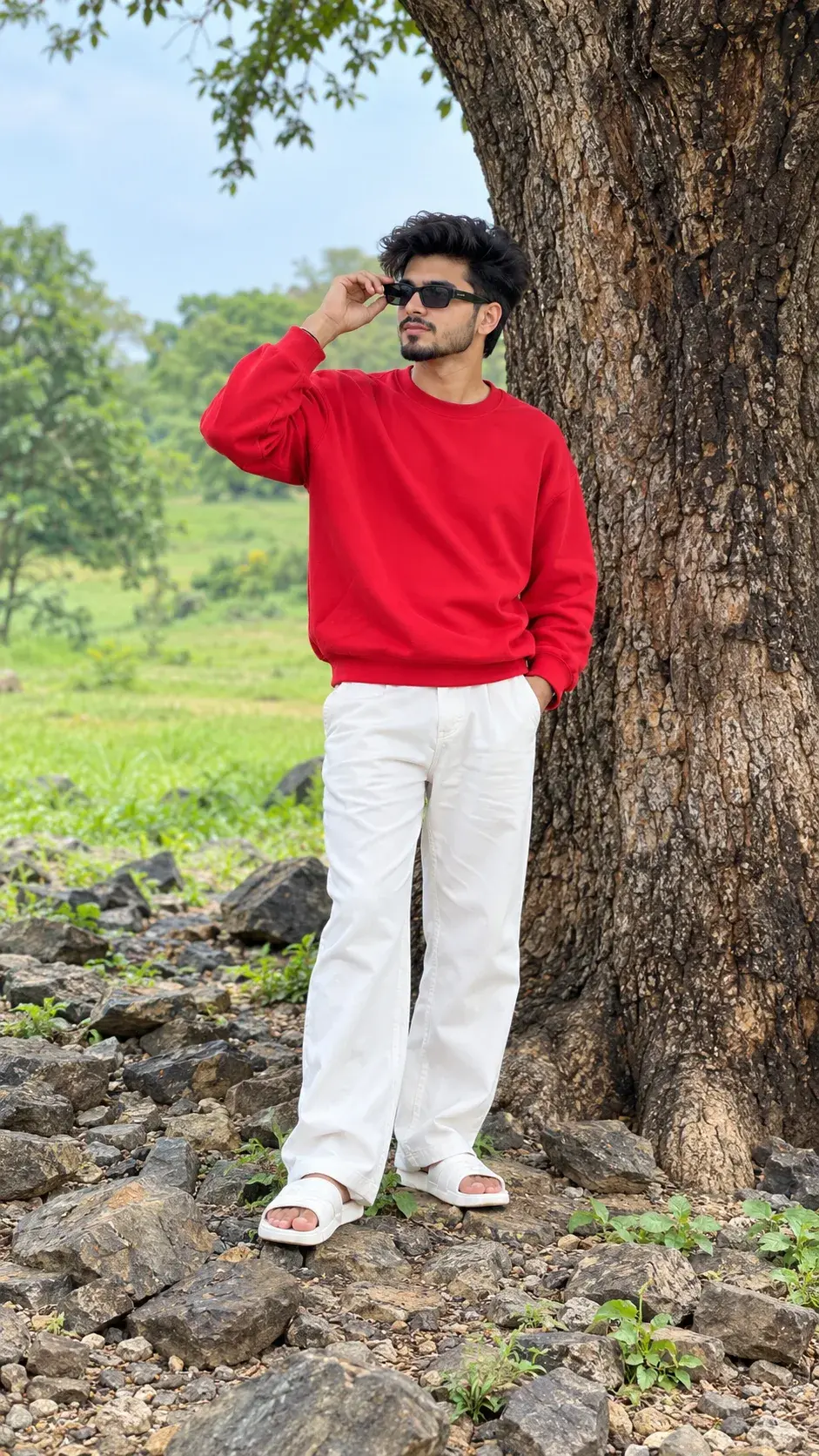 Outdoor Full-Body Portrait Of A Young Man In Red Sweatshirt Beside A Tree 🌿
