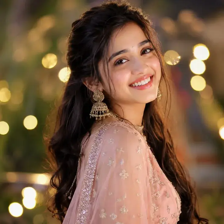 Portrait Of A Smiling Young Woman In A Soft Pink Traditional Outfit