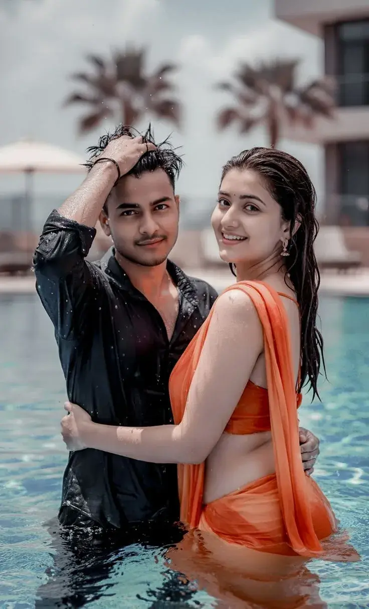 Romantic Candid Portrait Of Young Indian Couple In Swimming Pool