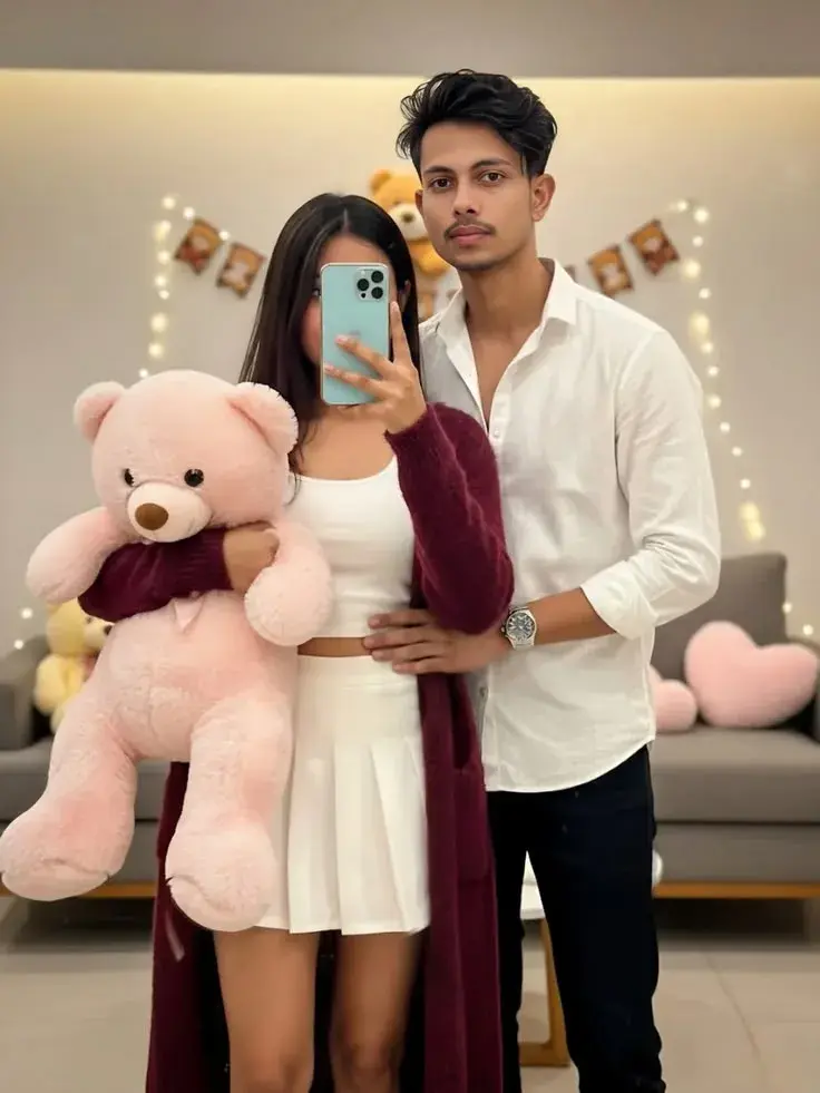 Romantic Indoor Mirror Selfie Of Indian Couple With Pink Teddy Bear