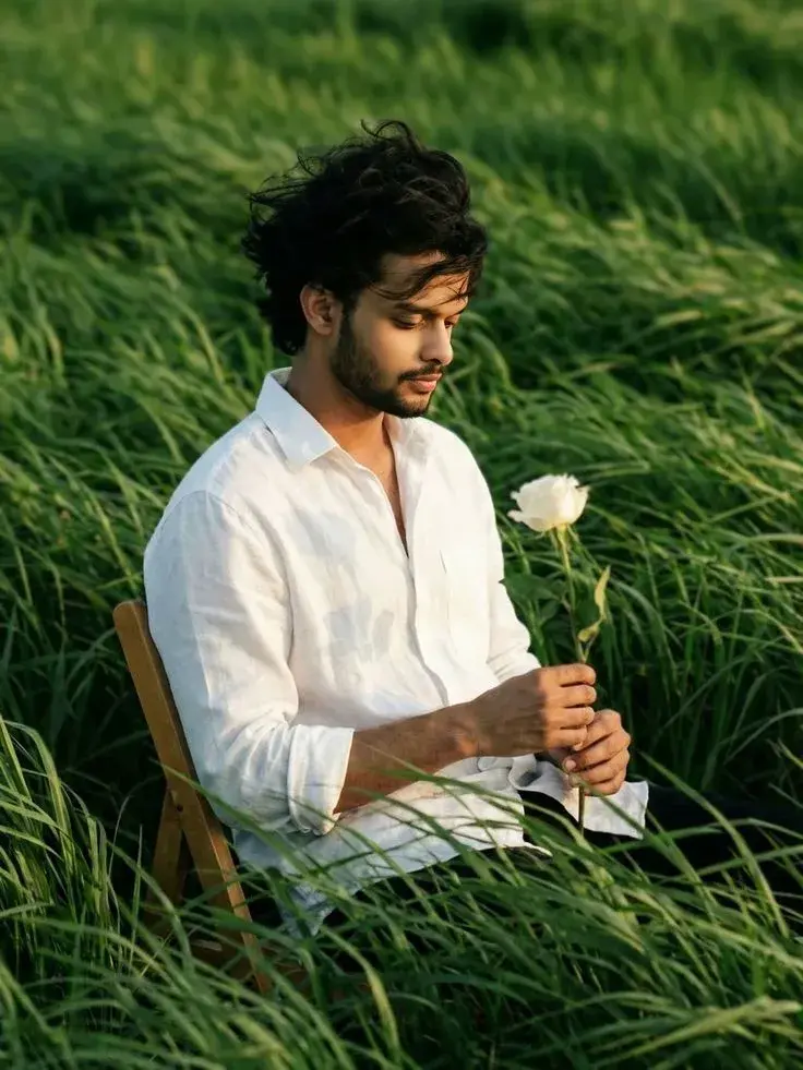 Romantic Nature Portrait – A Man Holding A White Rose In A Green Field