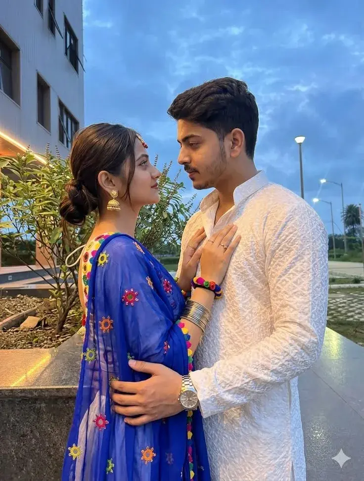 Romantic Twilight Promenade Portrait Of Young South Asian Couple In White Chikankari Kurta And Blue Mirror-Work Dupatta