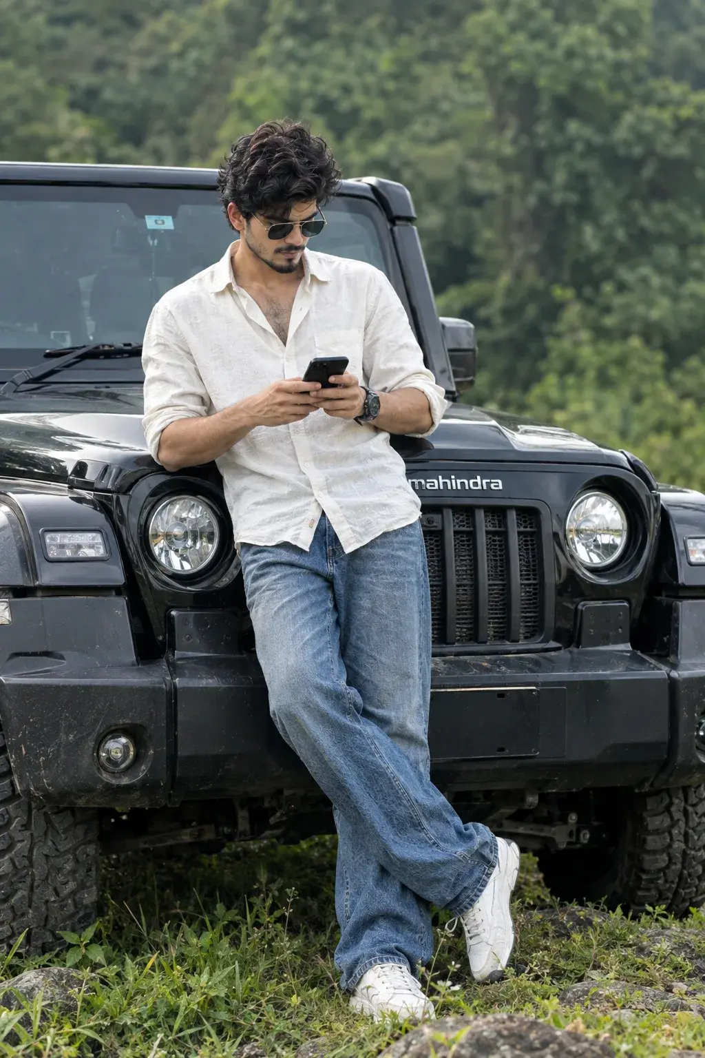 Stylish Young Man Using Smartphone While Leaning On Black Off-Road Suv In Nature