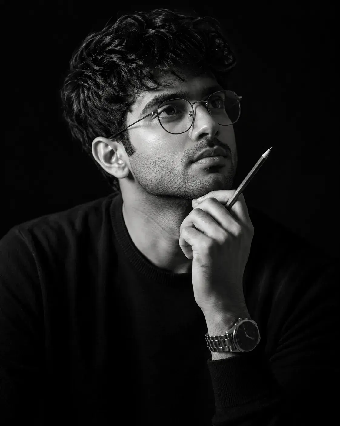 Thoughtful Portrait With Pencil And Glasses