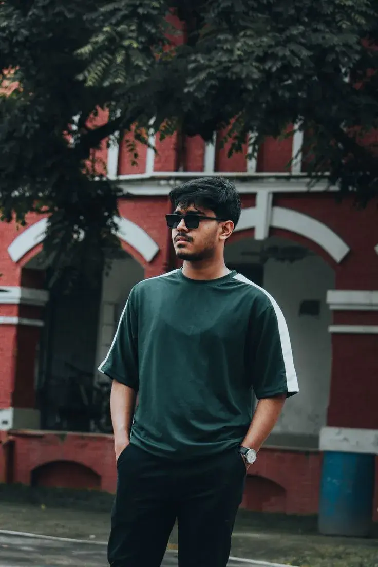 Urban Male Street Portrait In Oversized Green Tee By Heritage Building