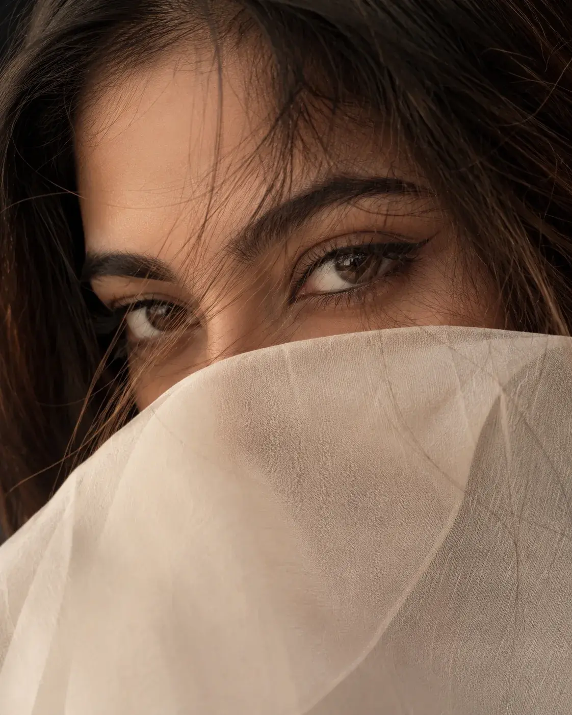 Veiled Gaze In Warm Shadows
